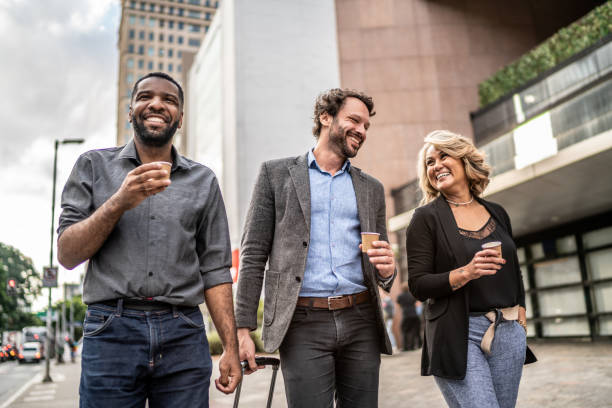 istock Coworkers talking while walking in the street 1489236739