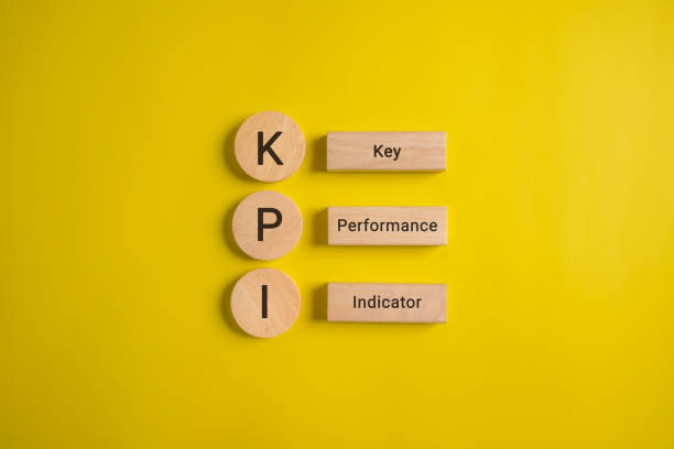 istock Key performance indicator, Businessman holding wooden cube with KPI 1489237079