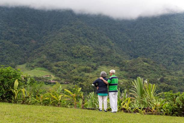 Unrecognizable senior couple looking at nature during travel to cloud forest, Mindo cloud forest, Quito, Ecuador.