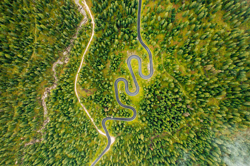 The famous Snake Road in the picturesque Giau Pass with a beautiful landscape painted in vibrant colors.