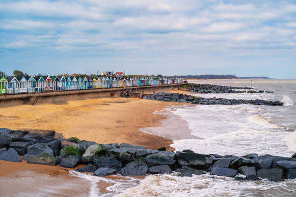istock Beach huts and rock built water breakers along the beach at Southwold in Suffolk, UK. 1489239124