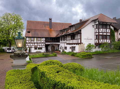 Busingen am Hochrhein, Germany - May 1, 2023: Restaurant Alte Rheinmuhle in Busingen, a municipality surrounded by Swiss territory - the only community in Germany that is entirely in an enclave.