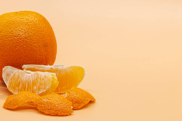 istock Orange orange slices on orange background 1489240693