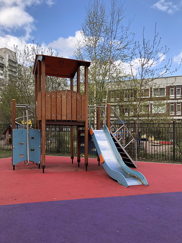slide, ladder and bridge on the children's playground in the city