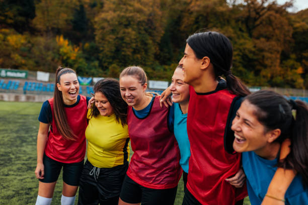 istock Cheerful soccer girls in group hug. 1489243070