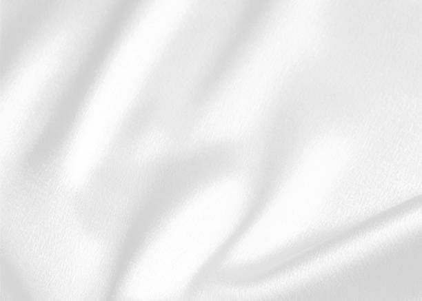 istock Smooth elegant white silk or satin luxury cloth texture for background 1489244067
