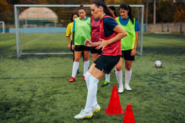 istock Cone exercises for women's soccer team. 1489244864