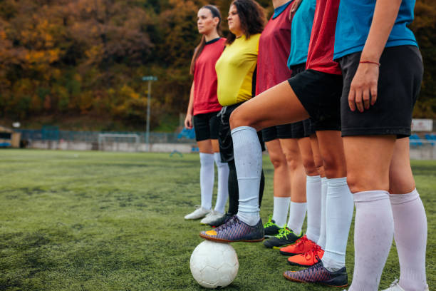 istock Female soccer team with ball. 1489245868