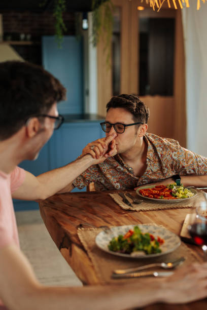 istock Romantic same sex couple at lunch. 1489256162