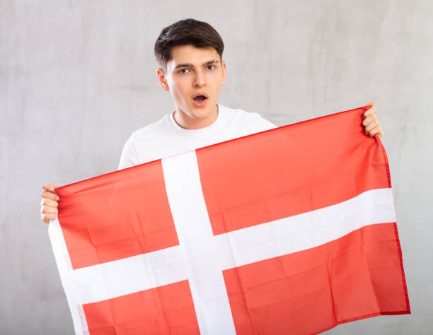 istock Guy holding the Danish flag in her hands 1489259544