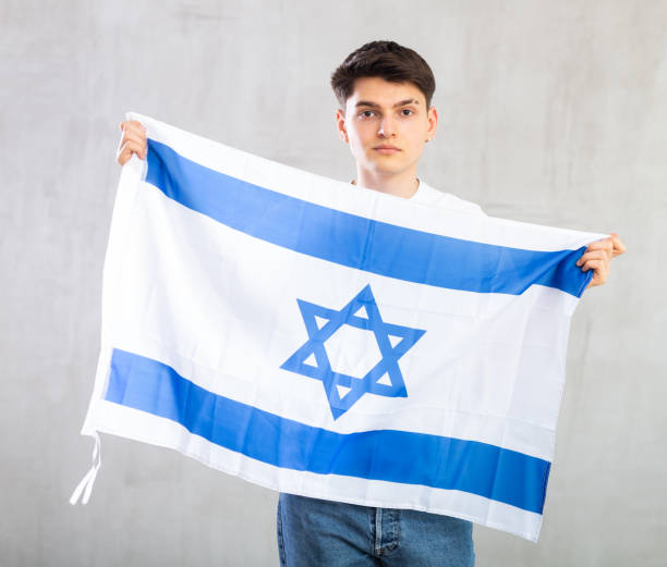 istock Guy holding the Israel flag in her hands 1489259779