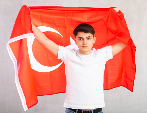 istock Focused young guy holding Turkey flag 1489259822