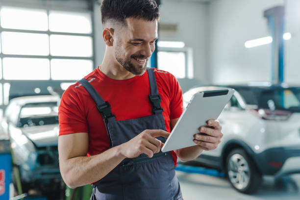 istock Automotive technician at the service station checking tasks on a digital tablet 1489262817