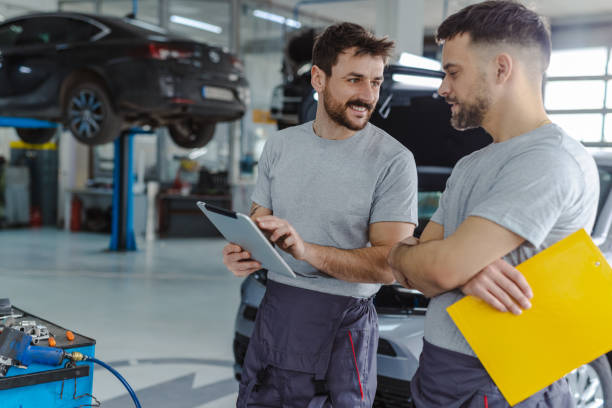 istock Automotive technicians working together at the service station 1489263050