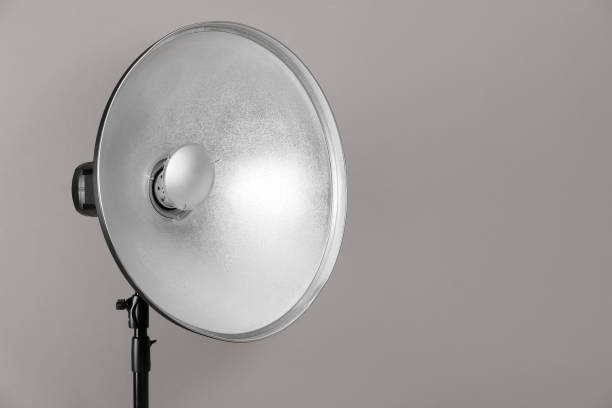 istock Professional beauty dish reflector on tripod against grey background, space for text. Photography equipment 1489264415