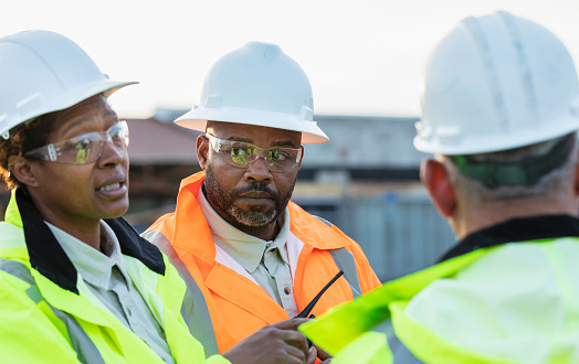 African-American man at construction site in meeting