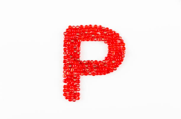 Alphabet of red beads on white background P