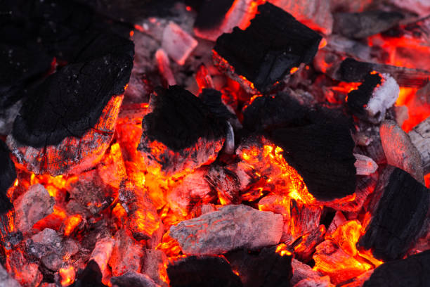 istock Barbecue Grill Pit With Glowing And Flaming Hot Charcoal 1489270740
