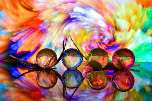 Crystal Gel water balls on colourfull texture rotation. Close up macro footage.