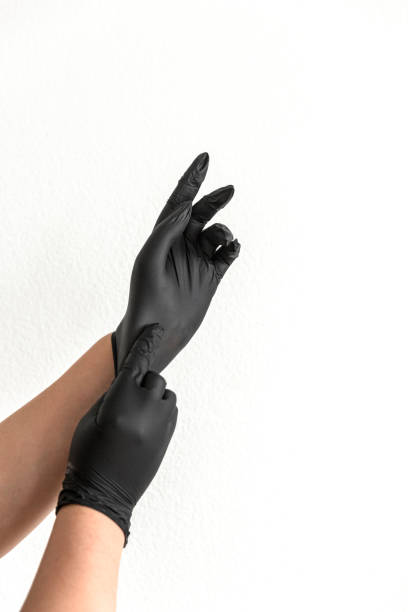 Close-up of putting on protective gloves