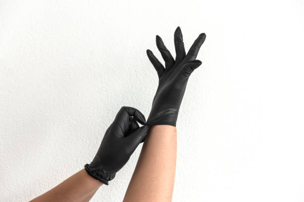 istock Close-up of putting on protective gloves 1489279389