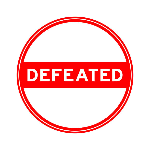 istock Red color round seal sticker in word defeated on white background 1489289562