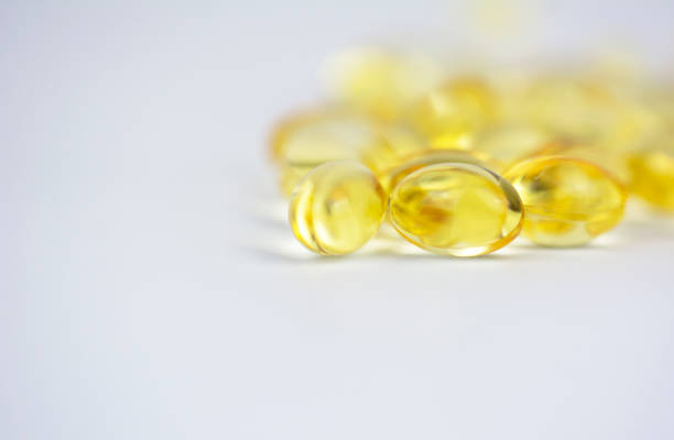 close up of capsules gel on white background. - nutritional supplement salmon food flax imagens e fotografias de stock