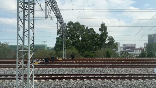 Filmed from a moving train, another high-speed train staggers by