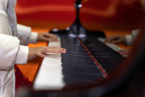 A child's hands on the piano