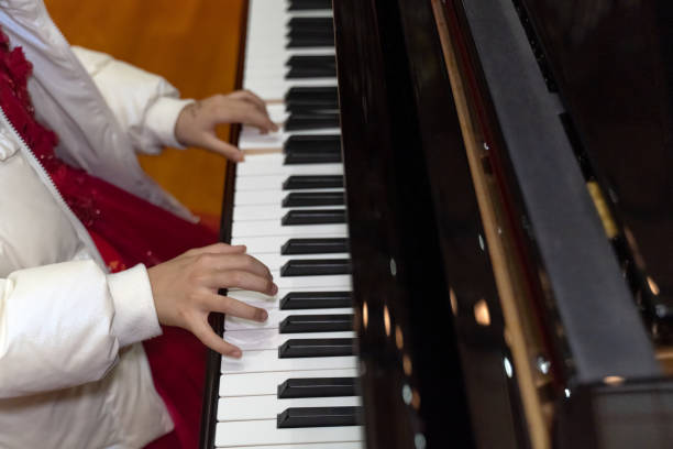 A child's hands on the piano