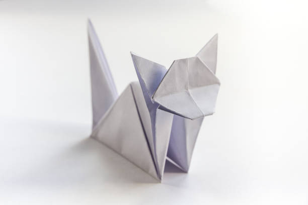 istock Paper cat origami isolated on a white background 1489330520