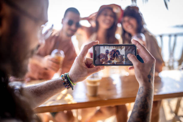 istock Group of friends having fun at beach bar 1489333282