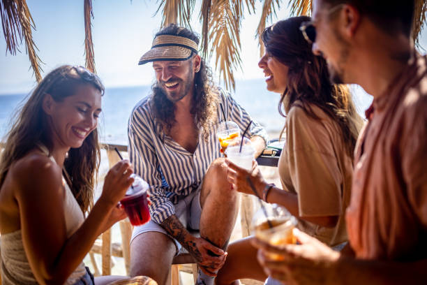 istock Group of friends having fun at beach bar 1489338101