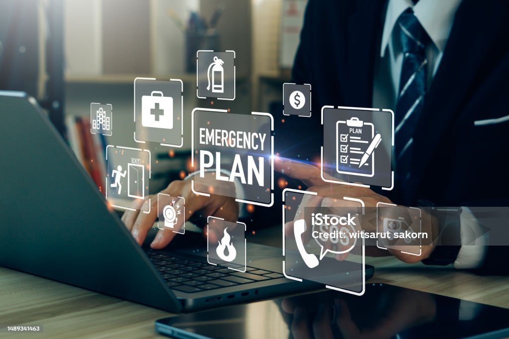 Concept of Emergency Preparedness Plan.Businessman touching Emergency Plan icon to learn and prepare in emergency situation .Business Evacuation Training concept. Emergency Planning Stock Photo Concept of Emergency Preparedness Plan.Businessman touching Emergency Plan icon to learn and prepare in emergency situation .Business Evacuation Training concept. Emergency Planning Stock Photo