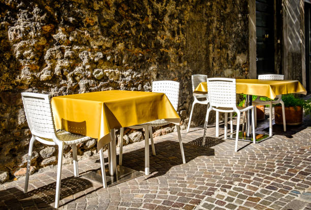 istock sidewalk restaurant in italy 1489341692