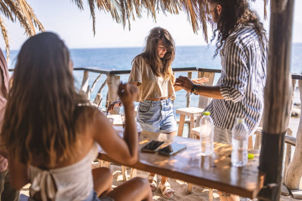 istock Friends having fun at beach bar 1489343991