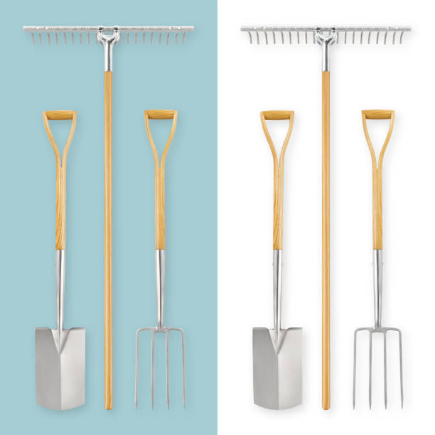 istock Gardening tools set. Stainless steel spade, digging fork and rake with wooden handle, vegetable garden work. Planting Equipment, spring time concept. Top view isolated on white and blue background 1489349163
