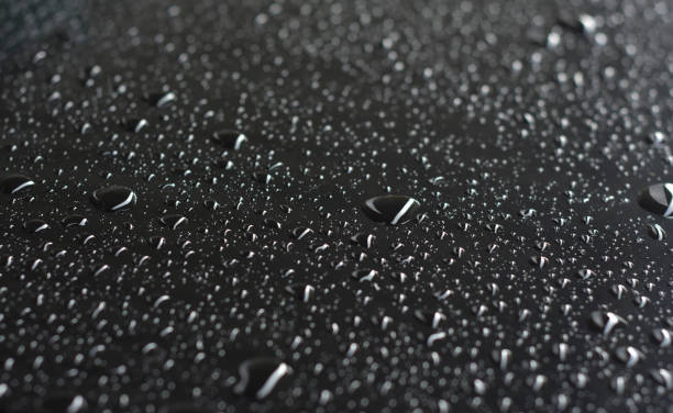 istock rain raindrops on the floor of car paint 1489349644