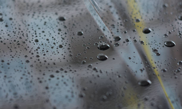 istock rain raindrops on the floor of car paint 1489349875