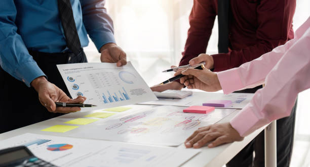 istock Business team analyzing income charts and graphs. Close up business analysis and strategy concept 1489351924