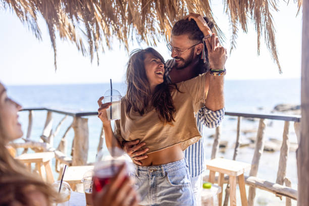 istock Cheerful couple in a beach bar 1489353533