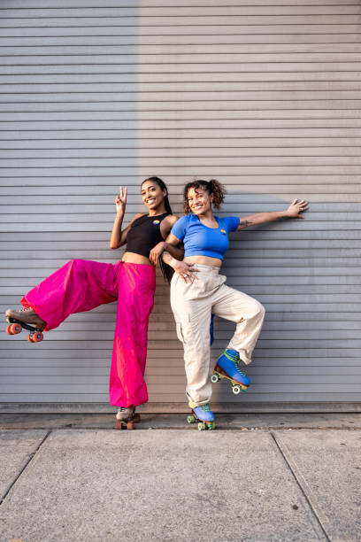 istock Two friends on vintage roller skates posing in Brooklyn, NYC 1489356209
