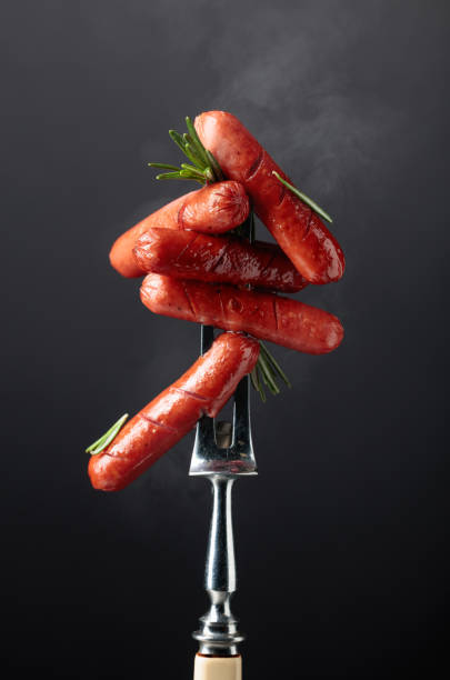 istock Hot grilled sausages with rosemary. 1489358585