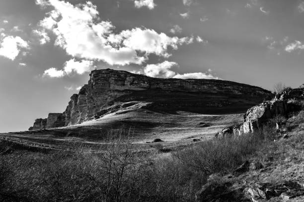 istock Mountains landscape with sky, trees, and rocks 1489360876