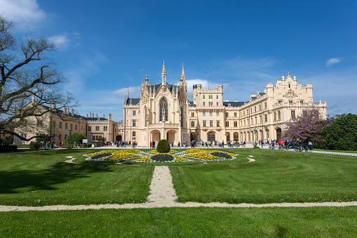 LEDNICE,CZECH REPUBLIC - May 7th, 2023: Chateau Lednice with beautiful gardens with flowers and parks on sunny summer day. Lednice-Valtice landmark, South Moravian region. UNESCO World Heritage Site.