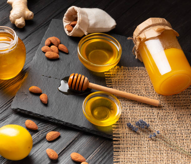 istock Honey in jars, dipper on a dark background. 1489363226