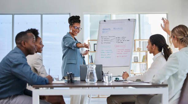 istock Business presentation, black woman leader and office training with teamwork and staff question. Management, conference room and sales team working with manager to problem solve for company strategy 1489364454