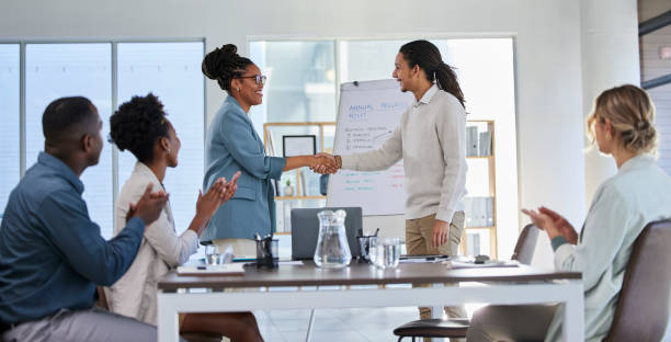 business handshake, black woman deal and office training with success and clapping from crowd. management, conference room and sales team working on a speaker coaching on innovation strategy - training business seminar clapping imagens e fotografias de stock