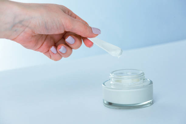 istock Woman hands taking moisturizer cream from jar 1489366251