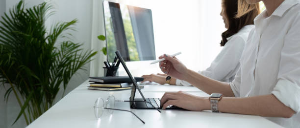 istock Female creative graphic designer drawing on graphics tablet at workplace with work tools and accessories in workspace 1489367422